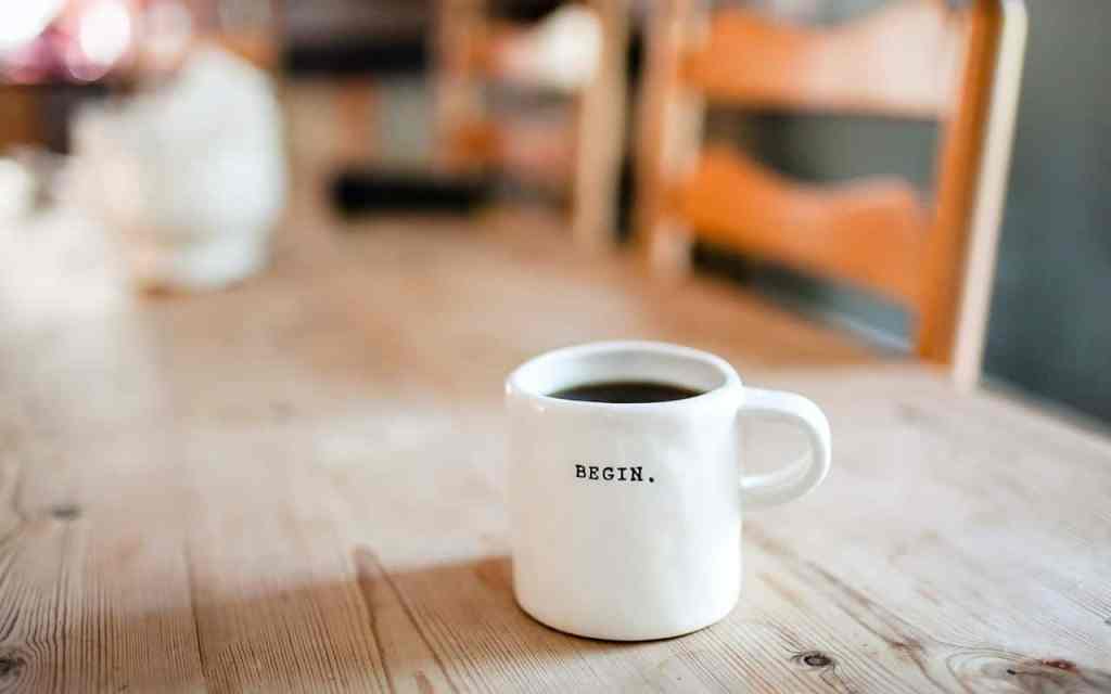 Coffee cup reads 'begin'